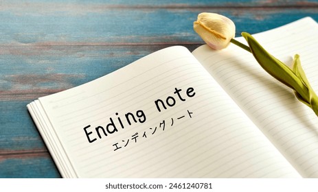 Ending note Open notebook with text and tulips_Blue board background diagonal