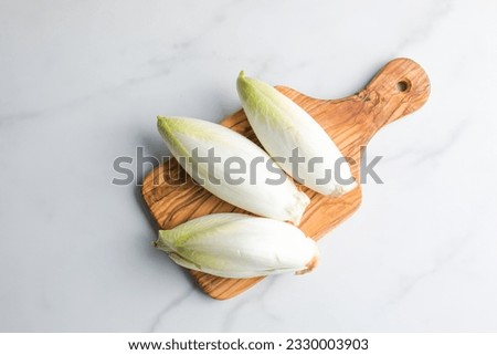 Endive - is a leaf vegetable belonging to the genus Cichorium, which includes several similar bitter-leafed vegetables on the table  Foto stock © 