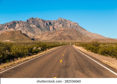 endless asphalt road with blue sky in Big Bend National Park, Texas, USA