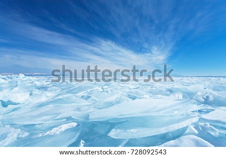 Endless blue ice hummocks in winter on the frozen Lake Baikal