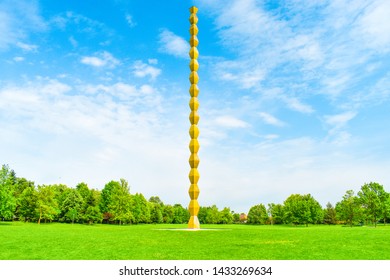 The Endless Column or Infinity Column in the central park from Targu Jiu. The endless Column or Coloana Infinitului against the sky. Golden Infinity Tower by Constantin Brancusi. 9.6.2019 - Romania