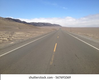 endless desert road in Peru