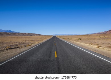 Endless open straight road in Death Valley National Park - Powered by Shutterstock