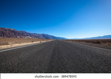 Endless Open Straight Road In Death Valley National Park Low Angle