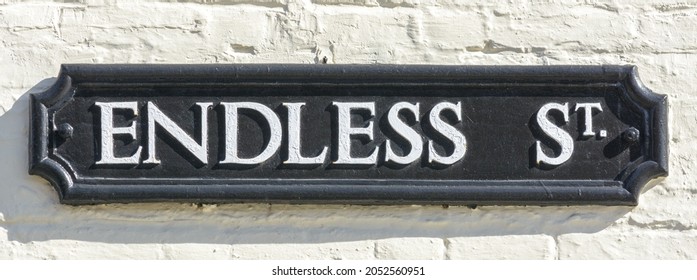Endless Street name sign, close up of old style of enaglish street plaque, shallow depth of field, autumn season 2021