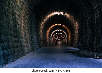 Endless tunnel as abstract background with vanishing point perspective - Powered by Shutterstock