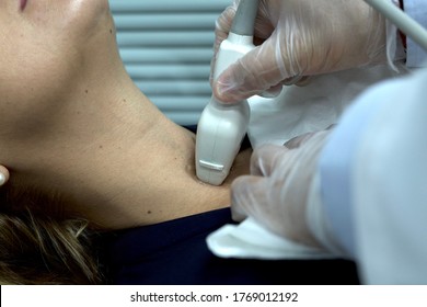 Endocrine Doctor Performing A Thyroid Ultrasound On A Patient Close-up. Physical Exam Of A Patient, Endocrine System Problems