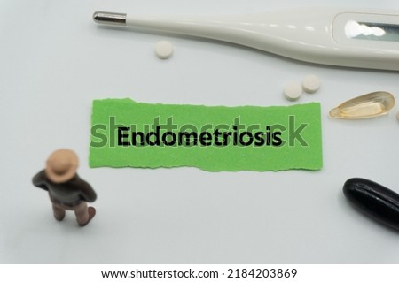 Endometriosis.The word is written on a slip of colored paper. health terms, health care words, medical terminology. wellness Buzzwords. disease acronyms.