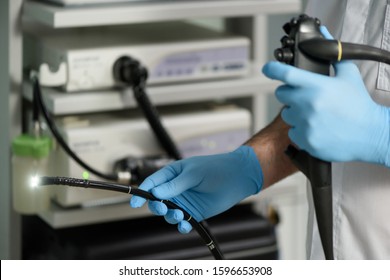 
Endoscopic examination in the clinic. Doctor holding an endoscope before a colonoscopy. Medical checkup.