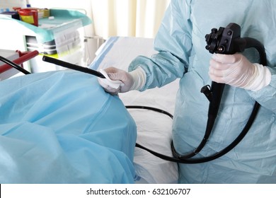 Endoscopy. Doctor holding endoscope before colonoscopy 