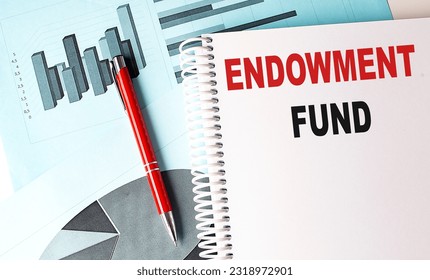 ENDOWMENT FUND text on notebook with pen on a chart background