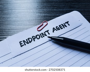 Endpoint agent writting on table background.