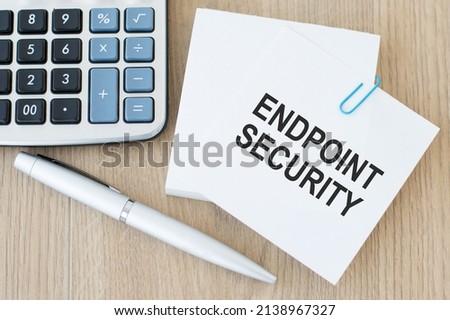 Endpoint security text on a card, office tools. Business, financial concept. Top view, flat lay.