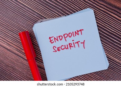 Endpoint Security write on sticky notes isolated on Wooden Table.