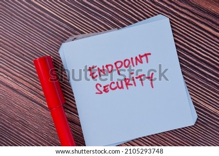 Endpoint Security write on sticky notes isolated on Wooden Table.