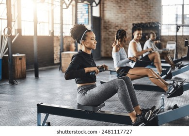 Endurance, gym and woman on rowing machine for health, wellness and body workout with class. Fitness, exercise and female athlete on ergometer equipment for cardio cross training in sports center.