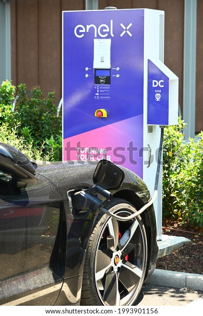 Enel X electric\
vehicles charging station in car parking space at shopping mall\
Turin Italy June 3 2021