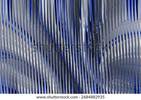 An energetic abstract visual featuring vertical lines in metallic blue and silver, creating a unique rippled texture and a sense of sophisticated movement.