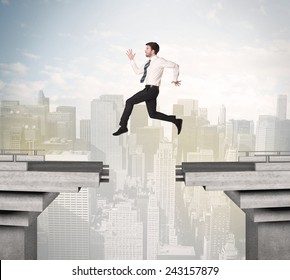 Energetic Business Man Jumping Over A Bridge With Gap Concept