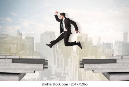 Energetic Business Man Jumping Over A Bridge With Gap Concept