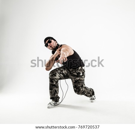 energetic and charismatic guy rapper dances break dance