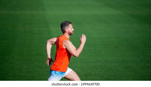energetic man on running track. sporty runner. stamina. sport and endurance. outdoor stadium sprint. - Shutterstock ID 1999639700