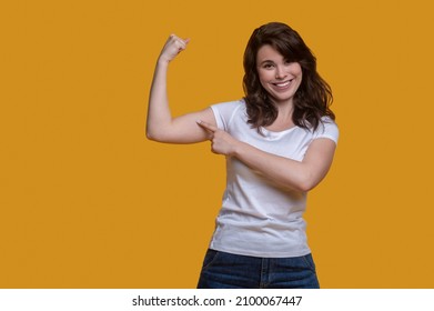 Energetic Sporty Lady Flexing Her Arm Muscles