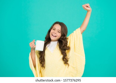 Energize Morning. Small Kid Blue Background. Little Girl Drink Cocoa Or Milk Before Sleeping. Cosy And Fluffy Pajama. Feeling Comfortable At Home. Happy Girl With Tea Cup. Good Morning Drink.