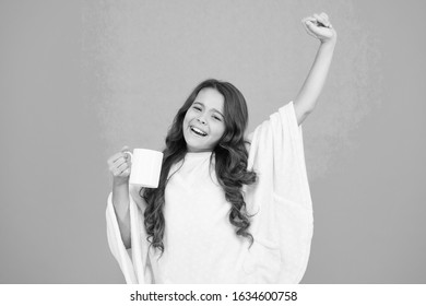 Energize Morning. Small Kid Blue Background. Little Girl Drink Cocoa Or Milk Before Sleeping. Cosy And Fluffy Pajama. Feeling Comfortable At Home. Happy Girl With Tea Cup. Good Morning Drink.