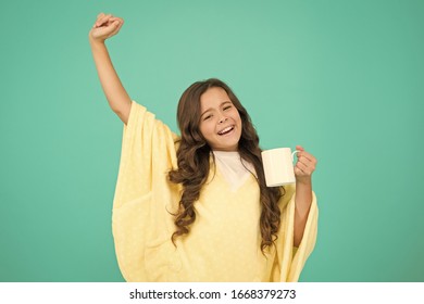 Energize Morning. Small Kid Blue Background. Little Girl Drink Cocoa Or Milk Before Sleeping. Cosy And Fluffy Pajama. Feeling Comfortable At Home. Happy Girl With Tea Cup. Good Morning Drink.