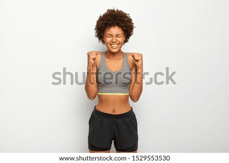 Similar – Slim woman in black bodysuit practicing yoga near sea or ocean during sunrise light. Flexibility, stretching, fitness, healthy lifestyle.