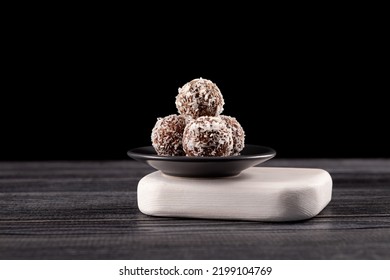 Energy Balls, alternative sweets during ramadan. Made from dates, honey, oatmeal, peanuts, coconut flakes. Raw vegan candies c with dried fruit and coconut.
