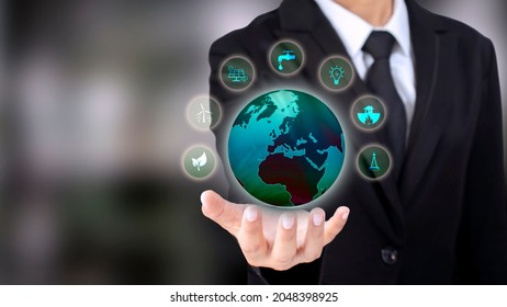 Energy Business Investment Ideas Environmentally Friendly Clean Energy Icon And The Globe In The Hand Of A Businessman Wearing A Suit