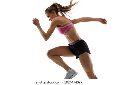 Energy. Caucasian professional female athlete, runner training isolated on white studio background. Muscular, sportive woman. Concept of action, motion, youth, healthy lifestyle. Copyspace for ad. - Powered by Shutterstock