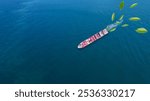 Energy concept Container ship green Leave. green transportation industry eco shipping for sustainable energy saving environmental low carbon. Express Cargo Container Ship with contrail in the ocean