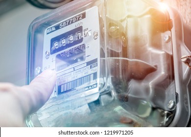 Energy Concept. Hand Is Touching The Transformer With Copy Space. Incorrect Energy Detection Method. Watthour Meter Of Electricity For Use In Home Appliance. Electronics