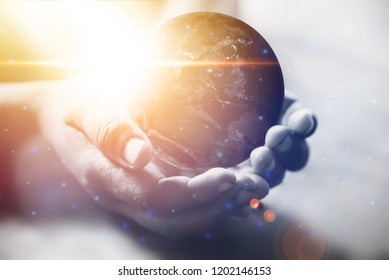 Energy and ecology concept, Human hand holding flying earth, Elements of this image furnished by NASA