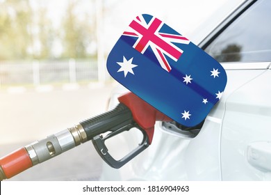 Energy And Economy Concept. Flag Of Australia On The Car's Fuel Filler Flap With Gas Pump Nozzle In The Tank.