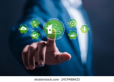 Energy efficiency concept. Businessman touching virtual screen of energy efficiency rating for energy efficient house building rate label audit. - Powered by Shutterstock