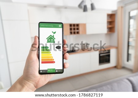 Energy efficiency mobile app on screen. Ecology, eco house concept
