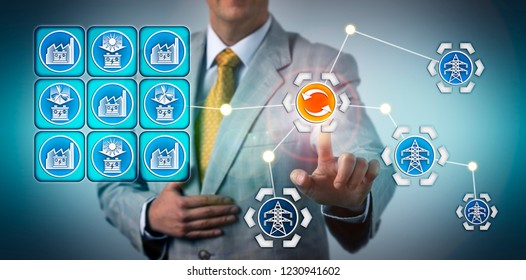 Energy Executive Initiating Power Transfer Between A Large Scale Battery Factory And The Electricity Grid. Industry Metaphor For Gigafactory Stabilizing Intermittent Renewable Energy Resources.