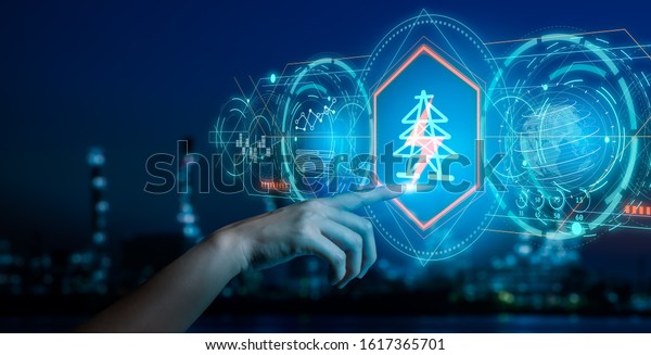 Energy and  power plant concept.Human hand holding\
a icon electric bolt on blurry bokeh power plant\
background.Industry 4.0 concept\
image.