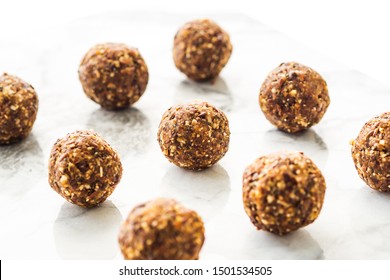 Energy Protein Balls With Healthy Ingredients On Marble Table. Home Made With Dates, Peanut Butter, Flax And Chia Seeds, Oats, Almond And Chocolate Drops. Food Modern Pattern On Marble Table