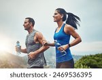 Energy, running and couple for outdoor exercise with water bottle, fitness adventure and training for sport competition. Runner team, man and woman in nature for cardio workout and marathon challenge
