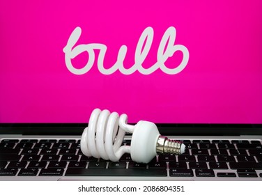 Energy Saving Bulb Seen Placed On Laptop Keyboard With Blurred BULB Energy Supplier Logo On A Screen. Stafford, United Kingdom, December 5, 2021.