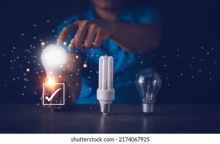 Energy saving concept, Fluorescent bulb, incandescent lamp and LED bulb, Human hand holding and touch for select LED light bulb for best power saving, Electricity conservation. - Powered by Shutterstock