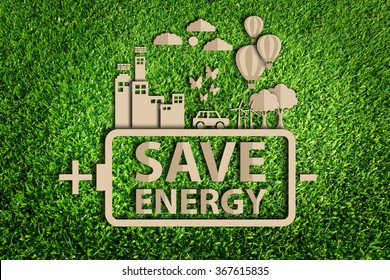  Energy saving concept. Paper cut of eco on green grass