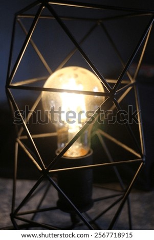 Energy saving electricity by using low wattage, modern and minimalist style lamp with soft yellow light.