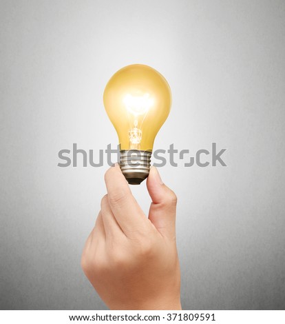 Energy saving light bulb, Creative light bulb idea in the hand