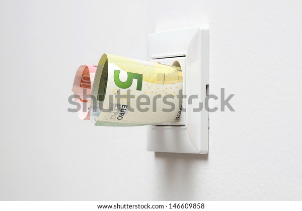 energy\
savings concept with power socket and\
money
